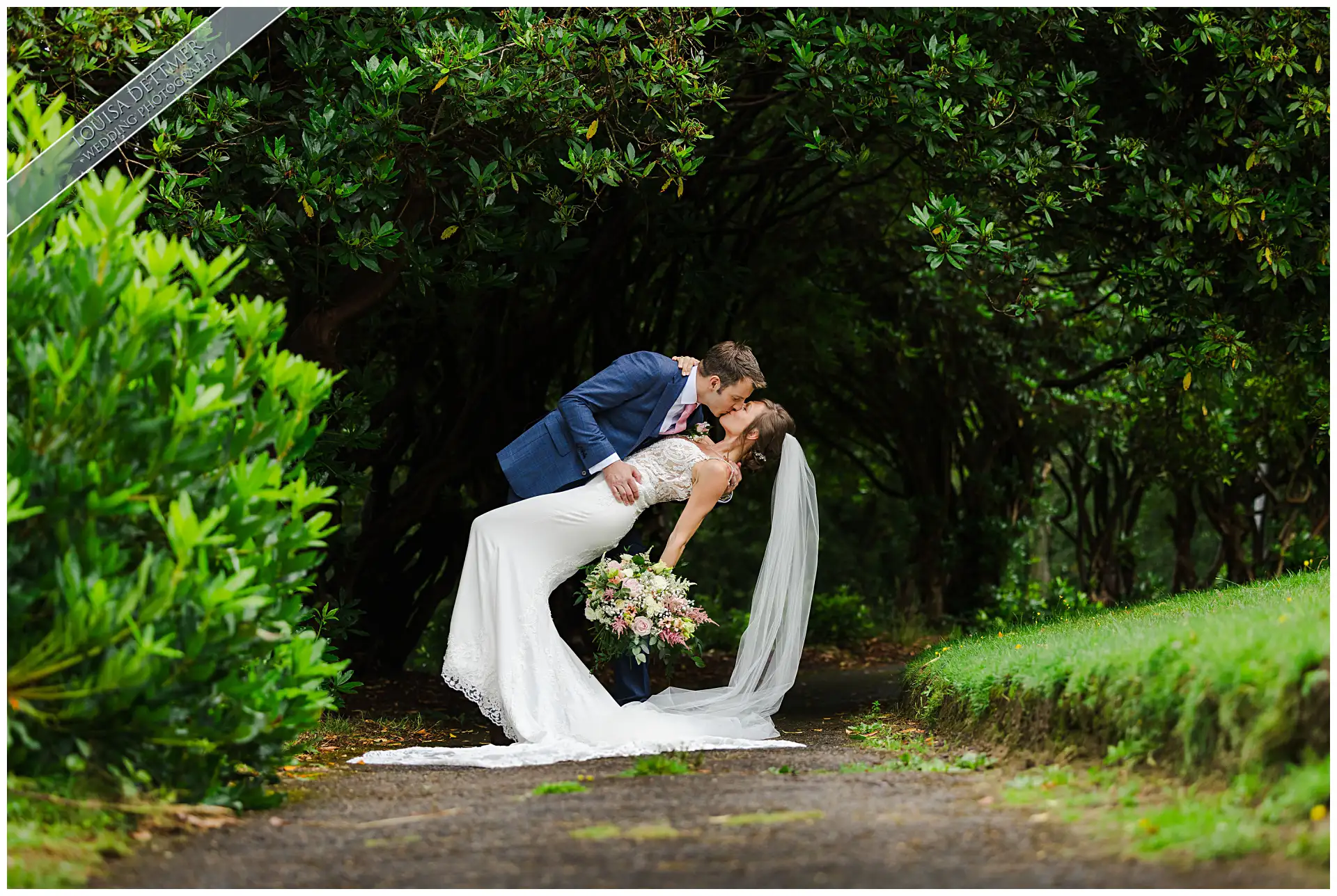 bride and groom kissing and leaning at The Spa Hotel, Tunbridge Wells