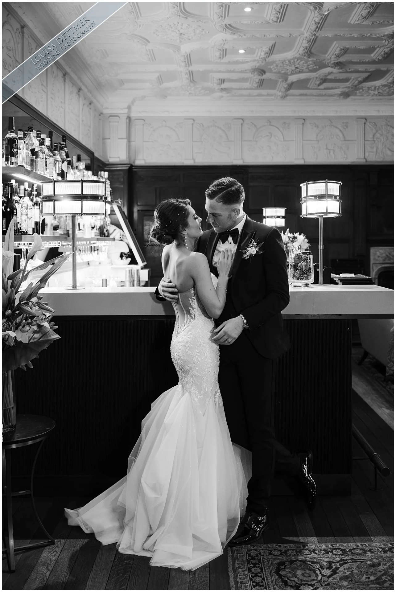 bride and groom, kissing, art deco bar, black and white photo, louisa dettmer photography, champneys eastwell manor,