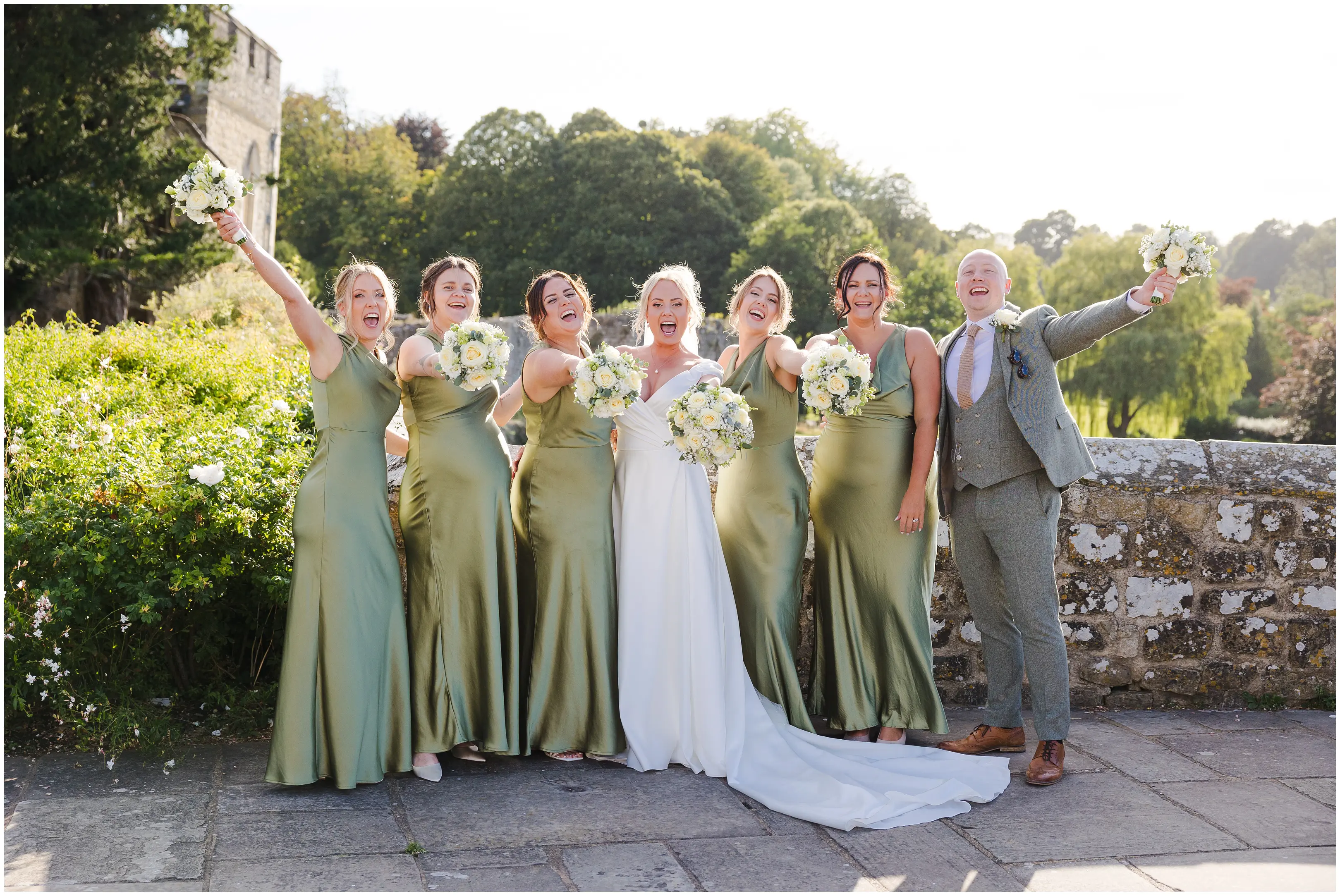 wedding party on stone wall leeds castle, louisa dettmer photography