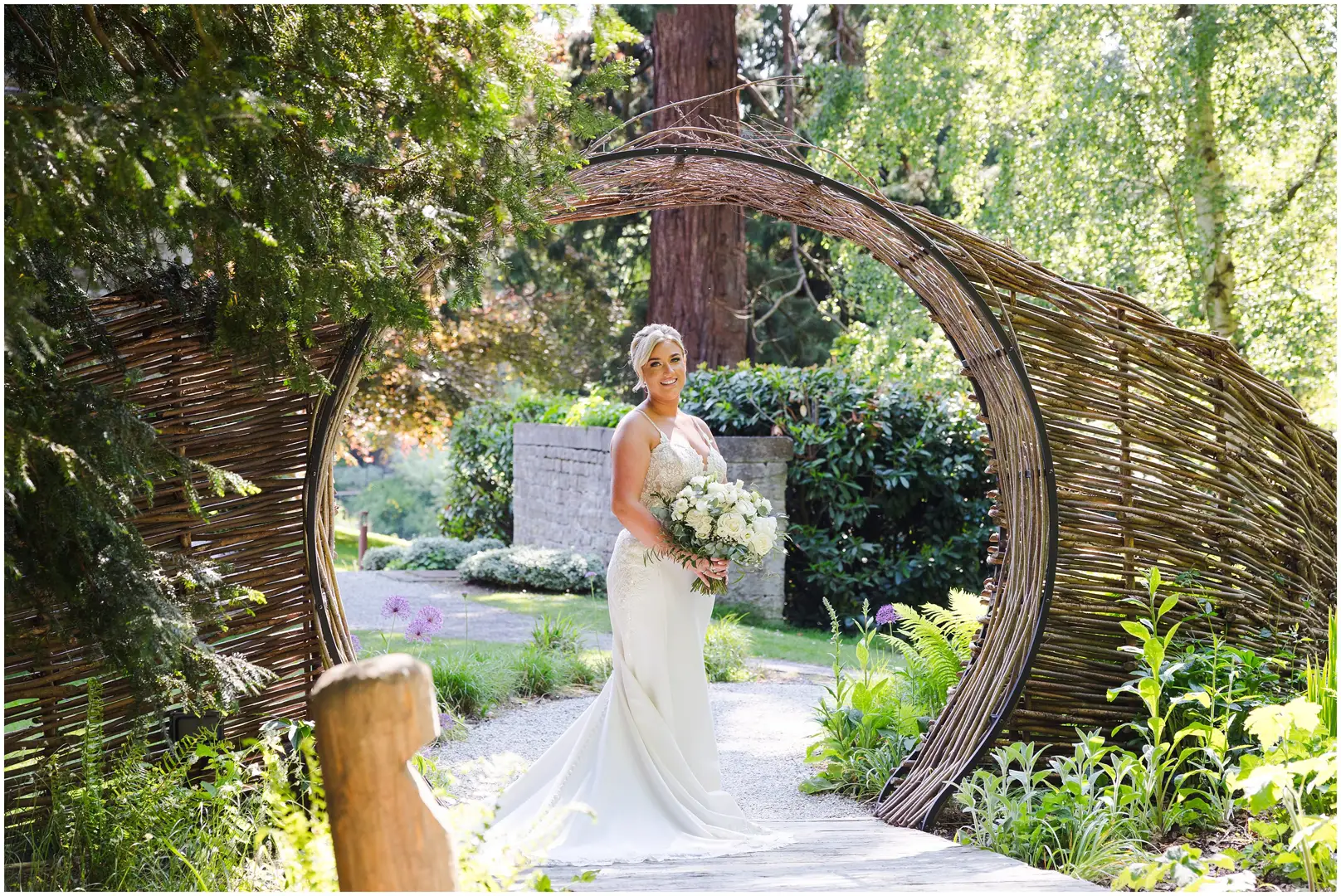 bride under circular garden arch romantic couples photos at the orangery maidstone