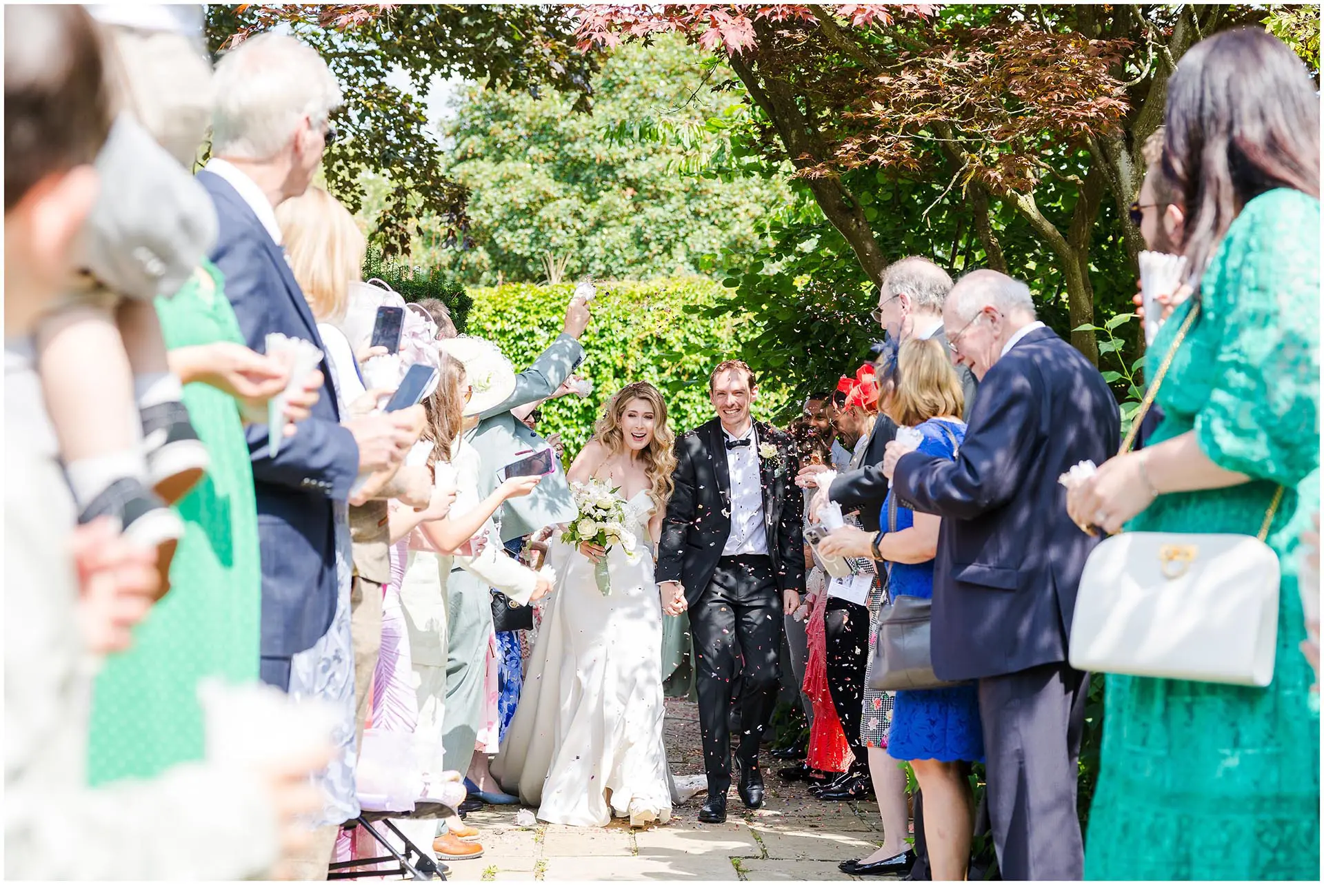 bride and groom confetti sendoff confetti at eastwell manor by louisa dettmer photography
