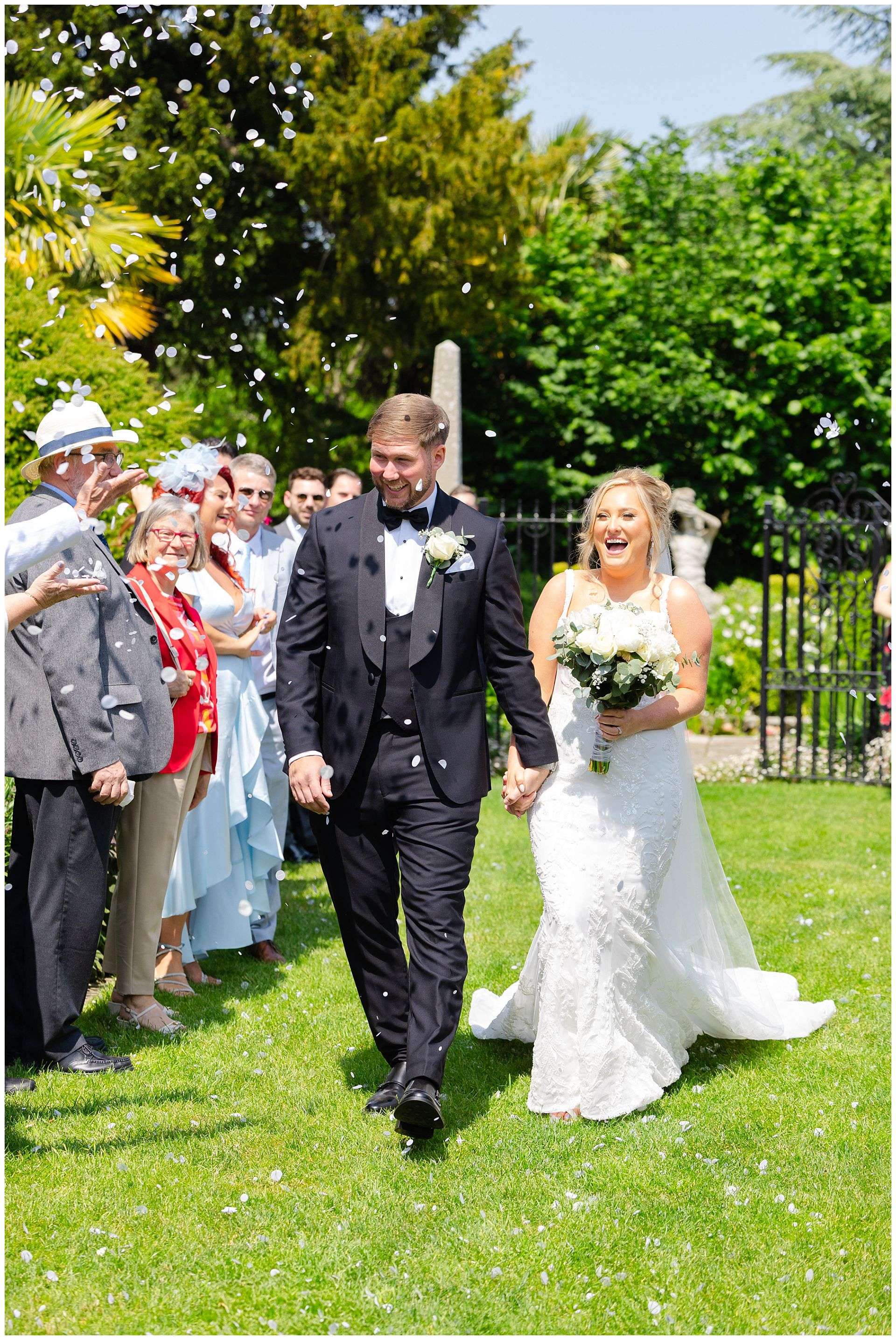 bride and groom confetti shot at chapel house estate by Louisa Dettmer Photography