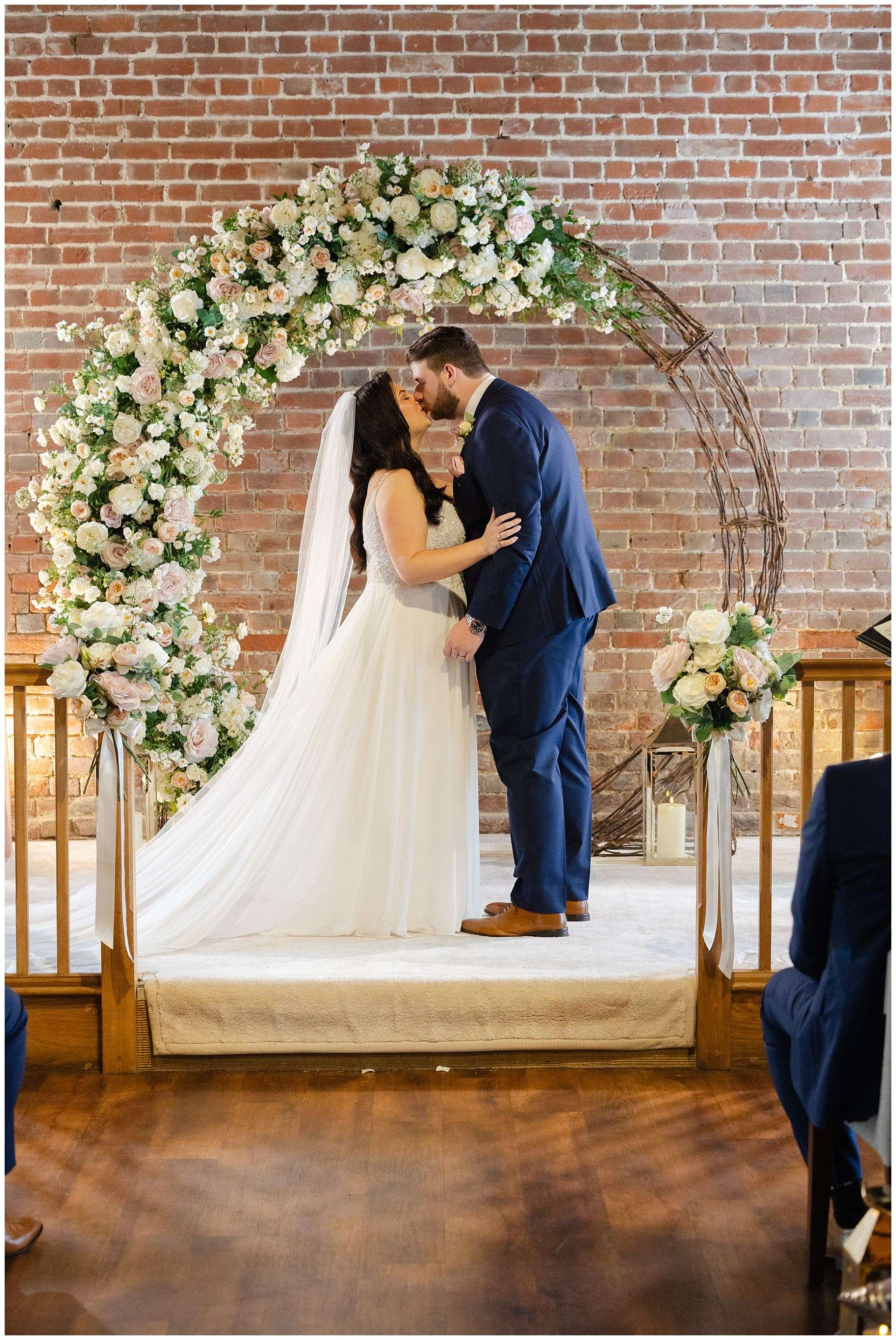 first kiss at Cooling Castle Barn Wedding Venue by Louisa Dettmer Photography