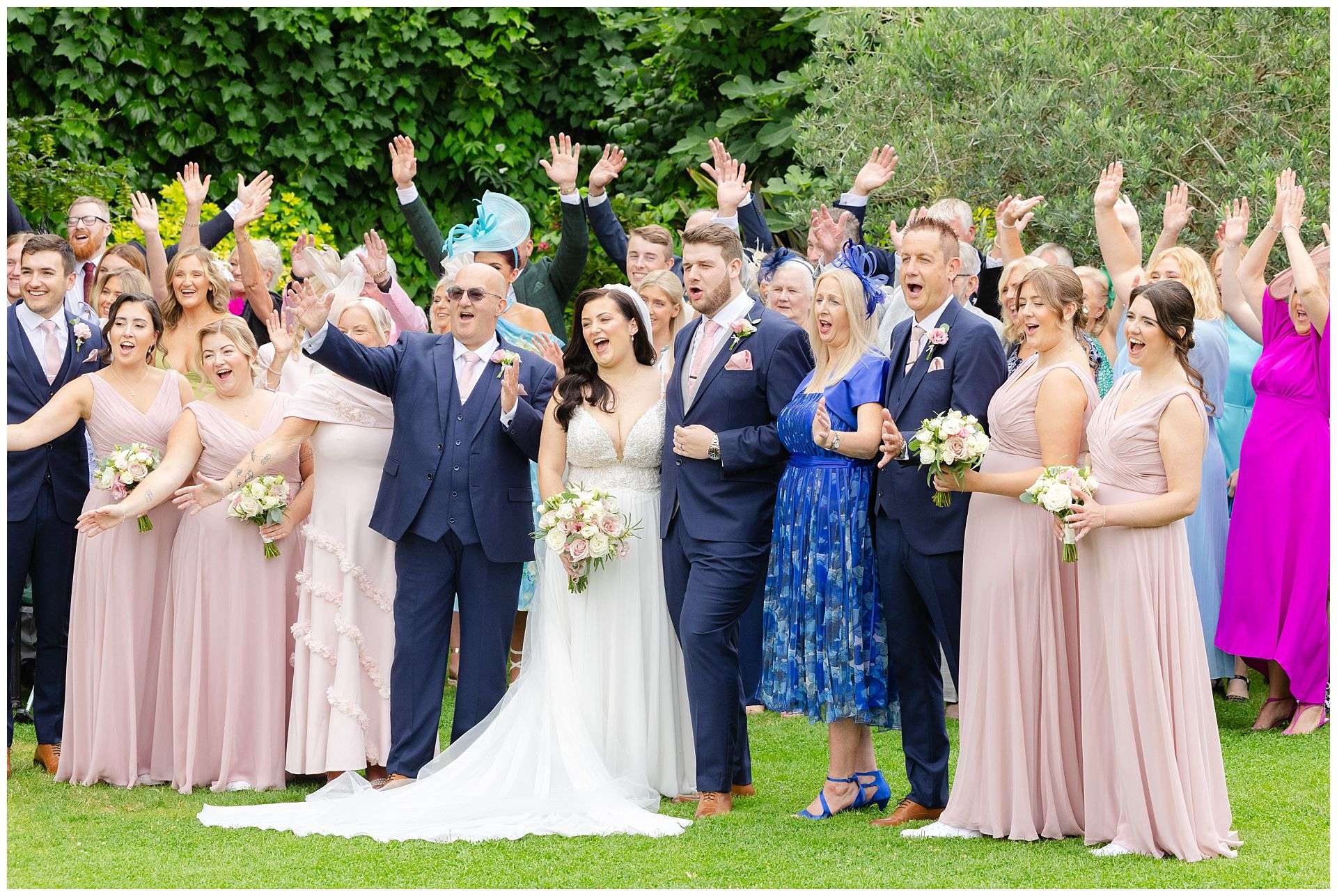 all guests group photograph at Cooling Castle Barn Wedding Venue by Louisa Dettmer Photography