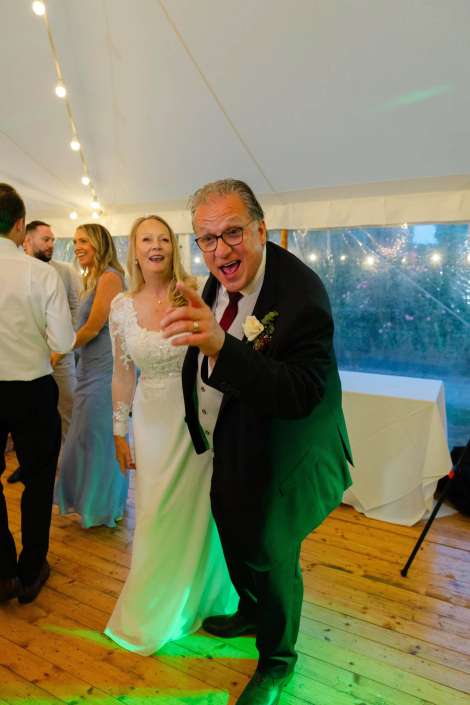 joyful wedding reception moment Joyful celebration at a wedding reception.