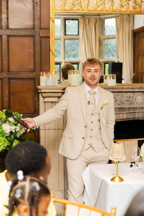groom’s beaming wedding toast eastwell manor, louisa dettmer wedding photography